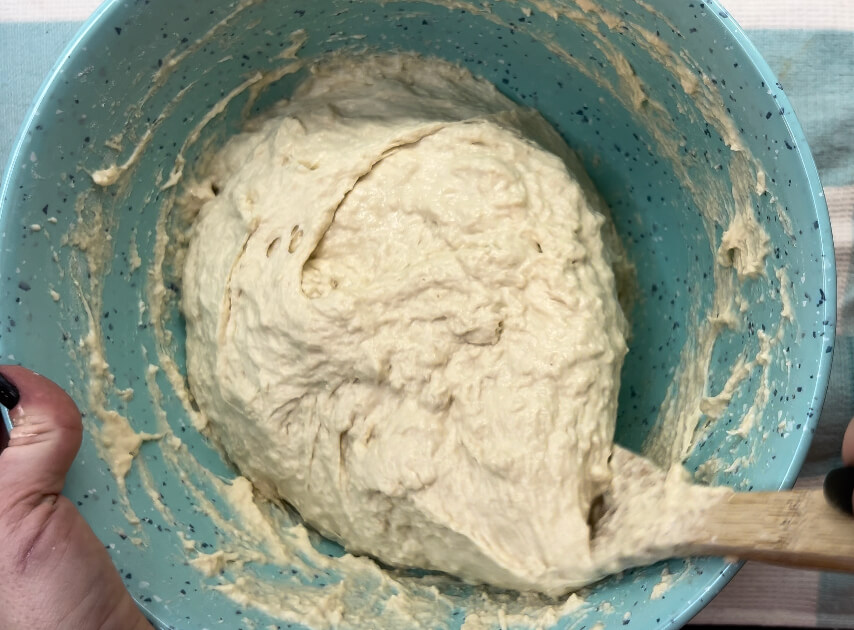 Stir and blend the peasant bread dough well.