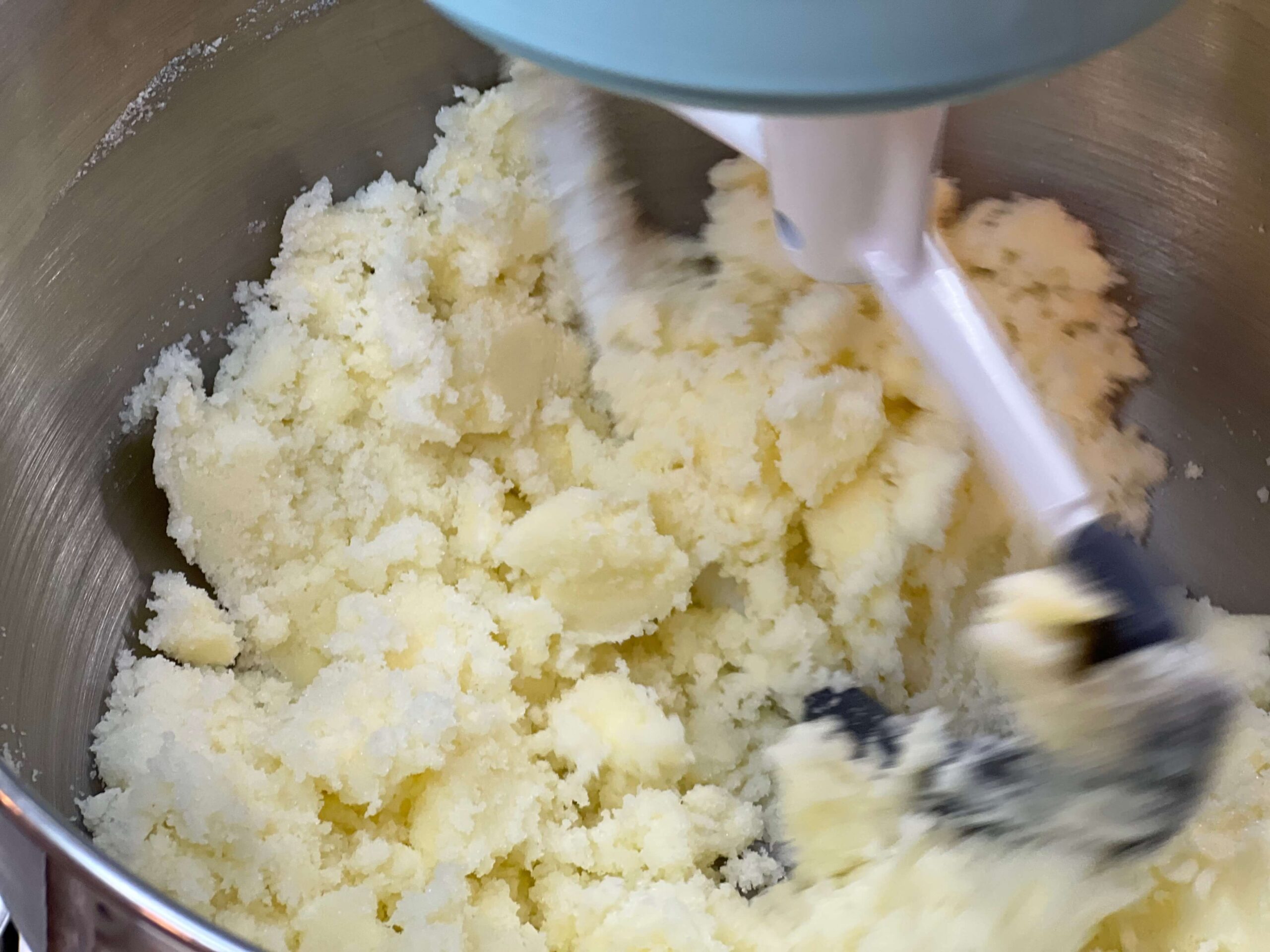 Mix butter and sugar well for the almond cookies