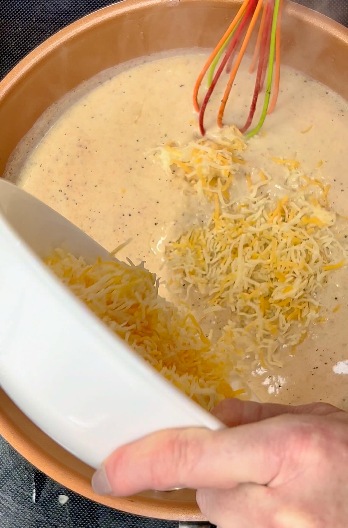 Add shredded fiesta cheese to the sauce preparations.