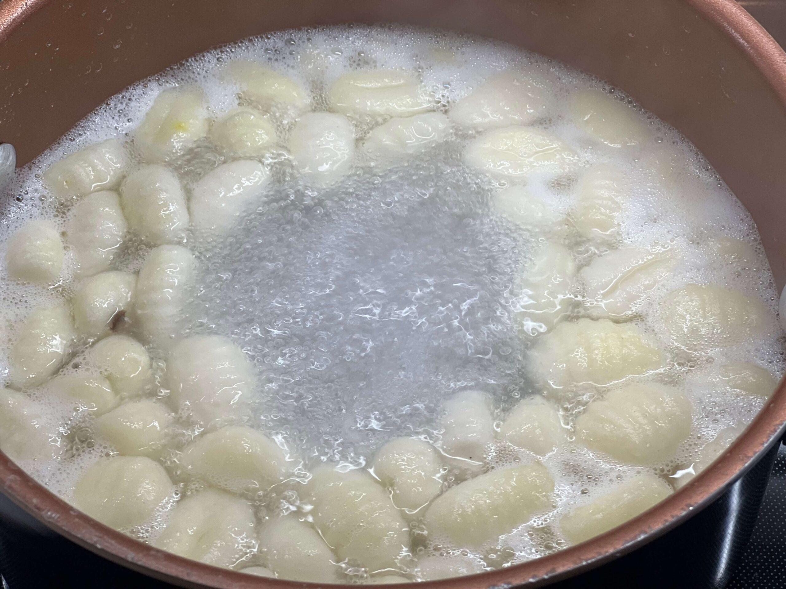 Cook gnocchi according to package directions.