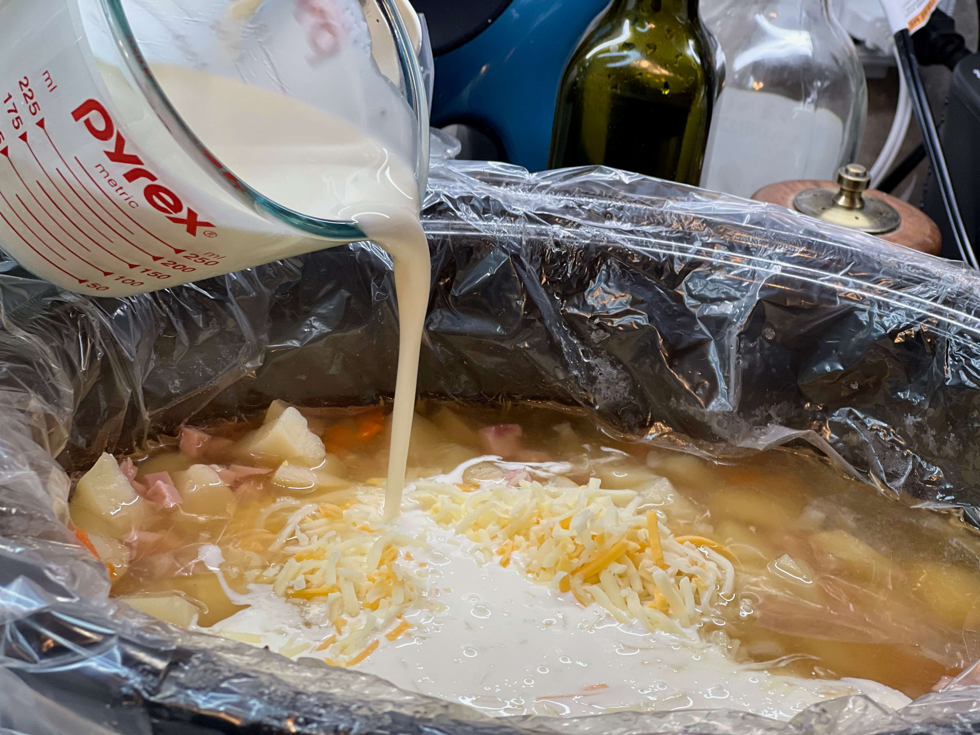 Once the potatoes are thoroughly done, add the heavy cream, cheese, and sour cream. Let cook for another 15-20 minutes.