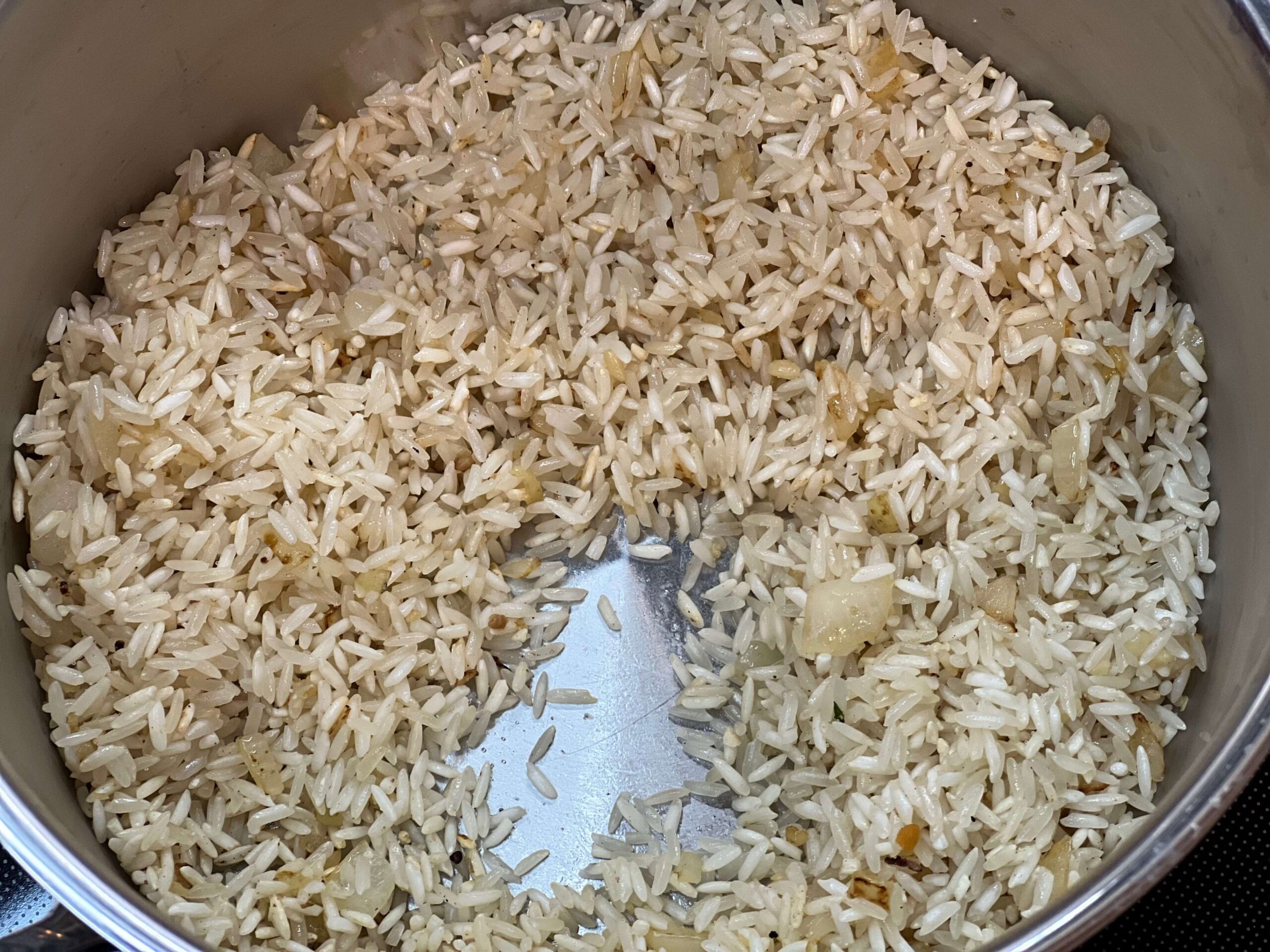 Lightly brown rice in with the onions and garlic.